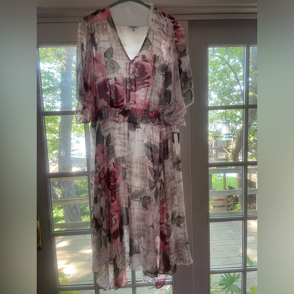 Flattering, flowing, handkerchief hem cocktail dress. Never worn. Size 24W.